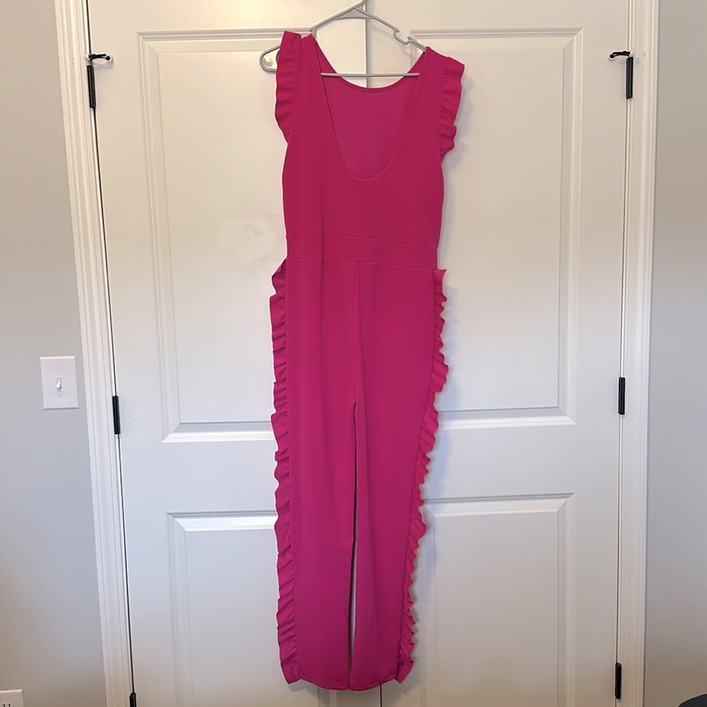 magenta jumpsuit with ruffles on side